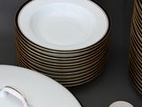 a lot of plates and cups on the table