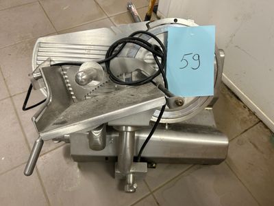 a machine that is sitting on the floor with a price tag attached to it