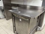 a stainless steel kitchen with a sink and a dishwasher