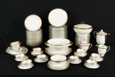 a lot of white and gold dishes and cups