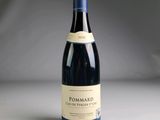 a bottle of wine that is sitting on a table