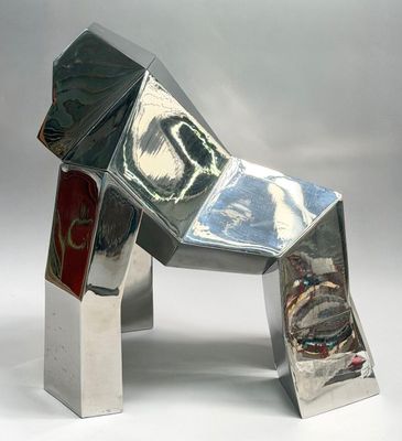 a metal sculpture of a dog made out of tin foil