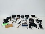 a lot of electronic gadgets and other items on the table
