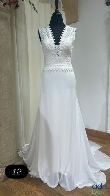 wedding dress on a mannequin display in a bridal shop
