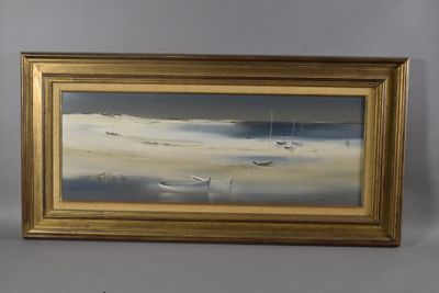 tableau représentant des bateaux sur la plage, dans un cadre doré
