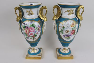 two vases that have been painted with flowers on them