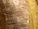 a close up of a couch with a pillow on it