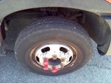 a close up of a flat tire on a truck