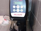 a coffee maker that is on a counter in a kitchen