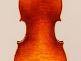 an old violin with a wooden back and a long neck