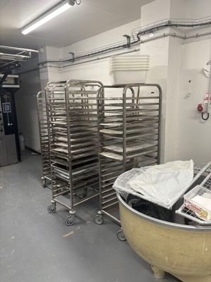 many trays of food in a large metal bowl