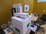 a printer sitting on top of a desk in a room