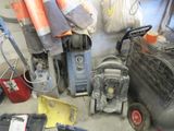 a pile of cleaning equipment and tools on the floor
