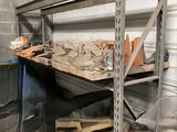a metal shelf with tools on it in a garage