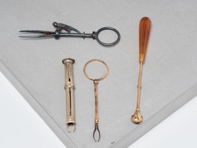 a pair of scissors, a pair of scissors and a pair of scissors on a table