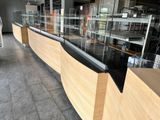 a glass display case in the middle of a store