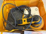 a yellow box filled with tools and other items