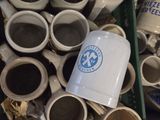 many cups of coffee in a basket on the floor