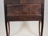 a small wooden table with a marble top on it