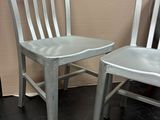 two chairs sitting next to each other in a room