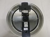 an overhead view of a metal object with a black handle