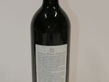 a bottle of wine that is sitting on a table