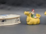 three figurines that are sitting next to each other