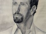 portrait of a man with a beard in a white shirt