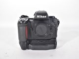 the camera is sitting on a white surface with a white background