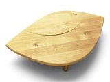 a wooden table with a leaf shaped top on it