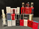 a lot of different types of perfumes on the table