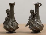 two vases that are sitting on a table