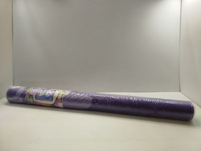 a close up of a roll of purple fabric on a white surface