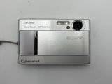 a silver camera that is sitting on a table