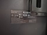 a close up of a black refrigerator with a label on it