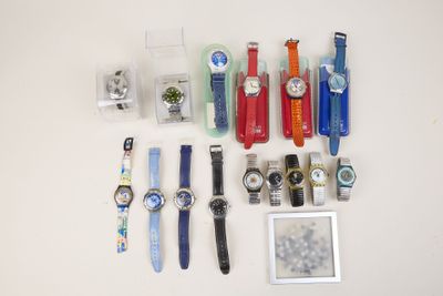 a lot of watches that are sitting on a table