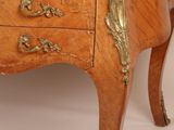 a small wooden table with a drawer on top of it