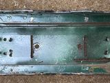 an overhead view of a metal box on a carpeted floor