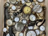 many different types of watches in a box