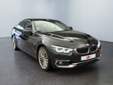 an image of a black bmw car in a showroom