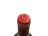 a bottle of wine that is sitting on a table