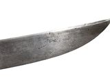 a large knife that is sitting on top of a table