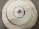 a white plate with a blue and white design on it