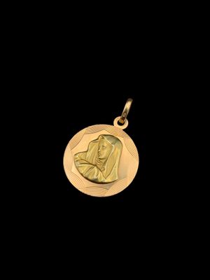 gros plan d'une pièce d'or portant un visage de femme