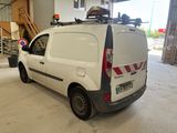a white van that is parked in a garage