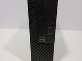 a dell dell desktop computer is sitting on a white surface