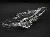 a glass object that is sitting on a black surface
