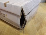 a box that is sitting on a table with a book inside of it