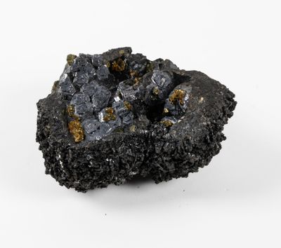 a close up of a piece of coal on a white surface