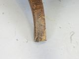 a close up of a wooden bench with a wooden seat